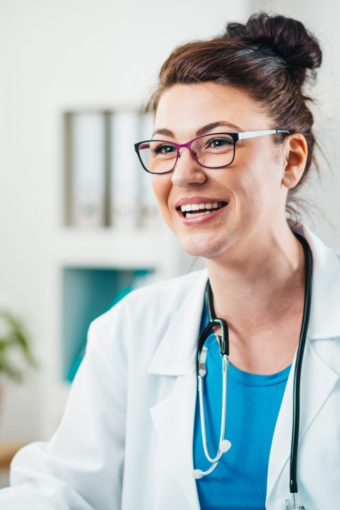 Portrait of Young Woman Doctor on the Job. Volunteer at the hospital gains practical knowledge in treating disease